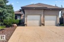 Stucco exterior with a two-car garage and concrete driveway - 928 Thompson Place Nw, Edmonton, AB  - Outdoor 