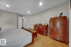 Bedroom featuring light wood-finish flooring, recessed lighting, and neutral wall tones - 