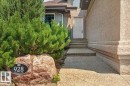 Entryway featuring a paneled door, multi-tiered steps, and stucco exterior - 928 Thompson Place Nw, Edmonton, AB  - Outdoor 