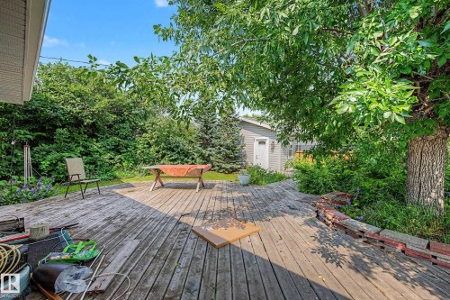 Spacious exterior deck featuring natural wood planks - 9516 129A Avenue Nw, Edmonton, AB - Outdoor With Deck Patio Veranda