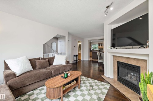 #20 1295 Carter Crest Rd Nw, Edmonton, AB - Indoor Photo Showing Living Room With Fireplace