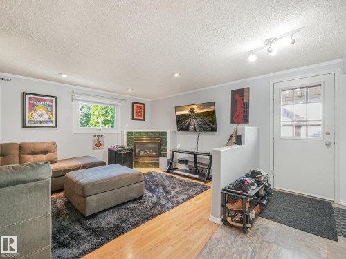 3527 41 Avenue Nw, Edmonton, AB - Indoor Photo Showing Other Room With Fireplace