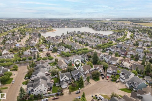 Aerial perspective showcasing a residential neighborhood with a large body of water - 416 Sparling Crest Sw, Edmonton, AB - Outdoor With View