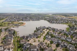Expansive residential development featuring a central lake - 