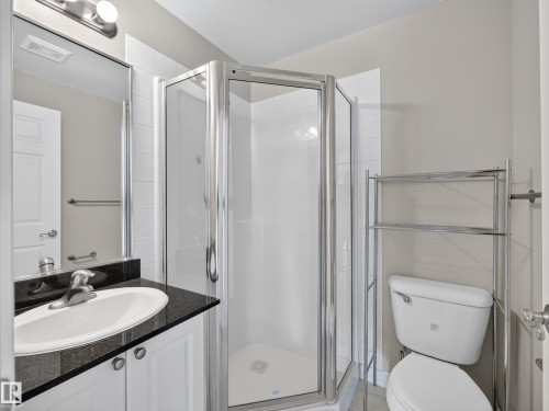 Enclosed shower with clear glass surround - #1208 9939 109 St Nw, Edmonton, AB - Indoor Photo Showing Bathroom