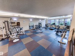 Dedicated fitness space featuring a multi-station weight machine, treadmills, stationary bikes, and an elliptical trainer - 