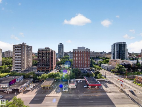 Urban landscape featuring various architectural styles, including multi-story residential buildings and commercial structures - #1208 9939 109 St Nw, Edmonton, AB - Outdoor With View