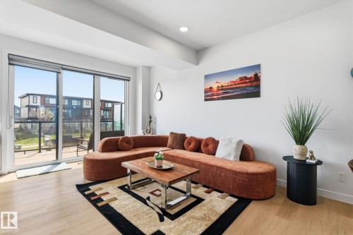 Living area with light wood-finish flooring, a contemporary ceiling, and recessed lighting - 8282 Chappelle Way Sw, Edmonton, AB - Indoor Photo Showing Living Room