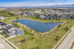 Neighborhood with a central lake feature and surrounding green spaces - 