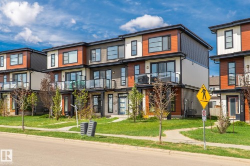 Modern multi-level exterior featuring varied siding materials and black-framed windows - 8282 Chappelle Way Sw, Edmonton, AB - Outdoor With Facade