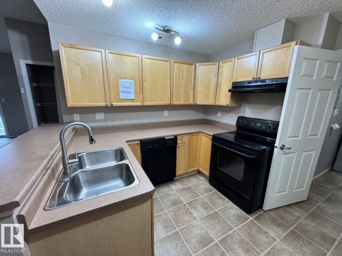 #28 2508 Hanna Cr Nw, Edmonton, AB - Indoor Photo Showing Kitchen With Double Sink