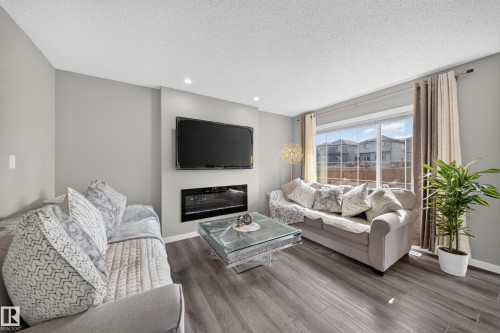 2366 Wonnacott Crescent Sw, Edmonton, AB - Indoor Photo Showing Living Room With Fireplace