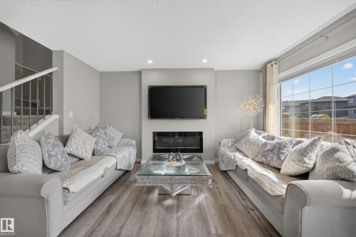 2366 Wonnacott Crescent Sw, Edmonton, AB - Indoor Photo Showing Living Room With Fireplace