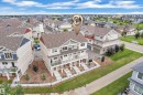 Modern multi-story townhouse with a shingle roof and light-toned siding - #64 17832 78 St Nw Nw, Edmonton, AB  - Outdoor 