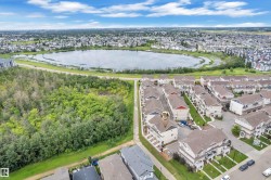 Aerial perspective showcasing a residential development with numerous multi-story townhomes - 