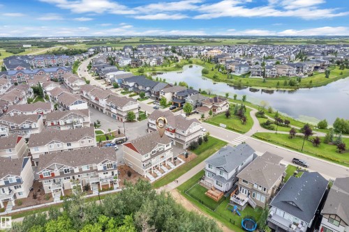 Aerial perspective showcasing a residential community with varied architectural styles - #64 17832 78 St Nw Nw, Edmonton, AB - Outdoor With View