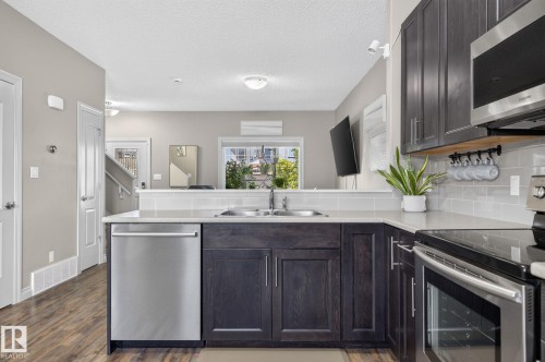 21 Currant Crescent, Fort Saskatchewan, AB - Indoor Photo Showing Kitchen With Double Sink