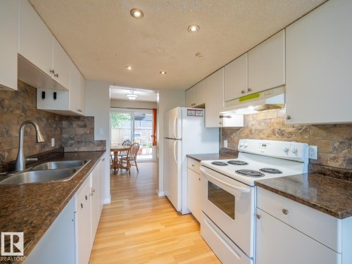 208 Grandin Village, St. Albert, AB - Indoor Photo Showing Kitchen With Double Sink