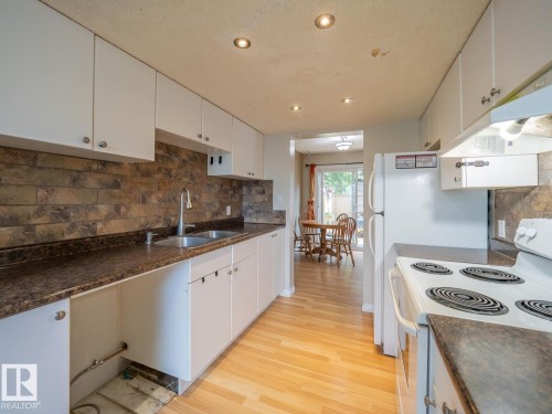 208 Grandin Village, St. Albert, AB - Indoor Photo Showing Kitchen With Double Sink