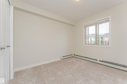Carpeted interior room with neutral wall tones - 