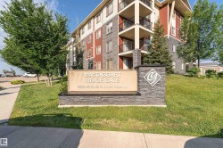 Multi-story building featuring stone and siding exterior accents - 
