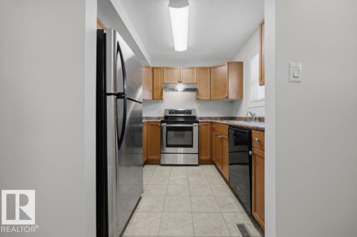 10473 24 Avenue Nw, Edmonton, AB - Indoor Photo Showing Kitchen With Stainless Steel Kitchen