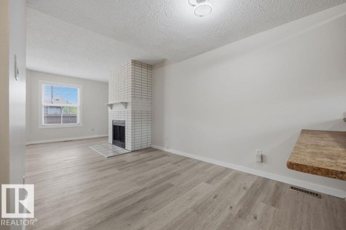 10473 24 Avenue Nw, Edmonton, AB - Indoor Photo Showing Other Room With Fireplace
