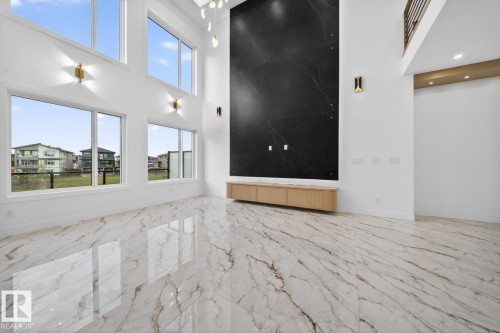 Spacious room featuring high ceilings and large windows - 11 Harley Way, Spruce Grove, AB - Indoor Photo Showing Other Room