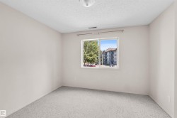 Carpeted interior space with a single window - 
