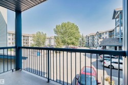 Private balcony with a concrete surface and black metal railing - 