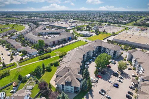 Expansive residential development featuring multi-story buildings with dark shingle roofs - #224 16303 95 St Nw, Edmonton, AB - Outdoor With View