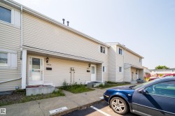 Two-story exterior with light-colored siding - 