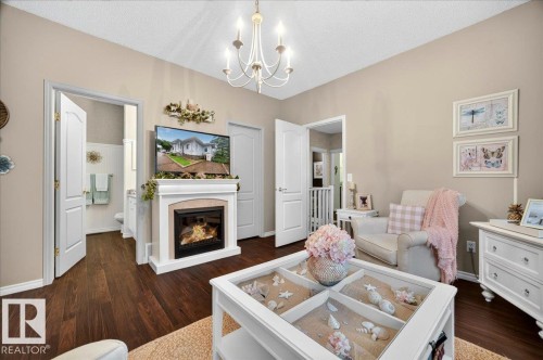#52 1780 Glastonbury Bv Nw, Edmonton, AB - Indoor Photo Showing Living Room With Fireplace