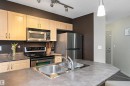 #111 11445 Ellerslie Rd Sw, Edmonton, AB  - Indoor Photo Showing Kitchen With Stainless Steel Kitchen With Double Sink 