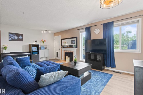 #64 3221 119 St Nw, Edmonton, AB - Indoor Photo Showing Living Room With Fireplace