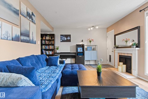 #64 3221 119 St Nw, Edmonton, AB - Indoor Photo Showing Living Room With Fireplace