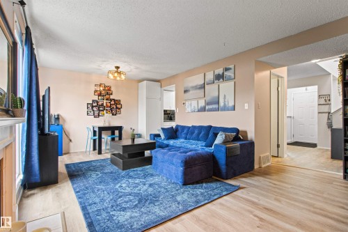 #64 3221 119 St Nw, Edmonton, AB - Indoor Photo Showing Living Room With Fireplace