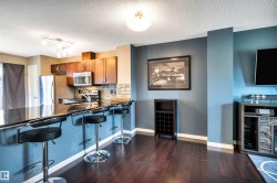 Kitchen bar seating with a dark countertop - 