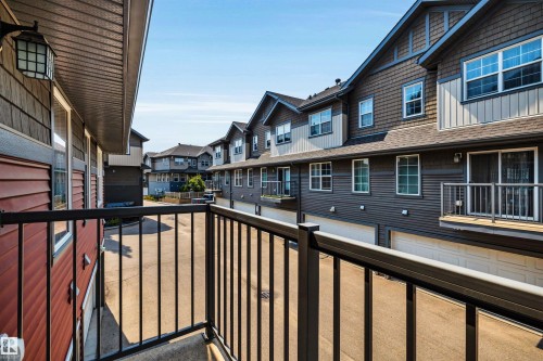 Exterior balcony with black metal railing - 571 Orchards Boulevard Sw, Edmonton, AB - Outdoor With Balcony With Exterior