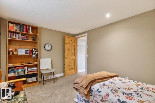 Recessed lighting illuminates neutral-toned walls and plush carpeting - 27 Milford Crescent, Sherwood Park, AB - Indoor Photo Showing Bedroom