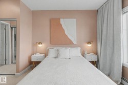 Warm-toned interior featuring wall-to-wall carpeting and large windows with full-length drapery - 