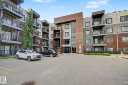 Contemporary multi-story building featuring brick and stucco exterior finishes - 