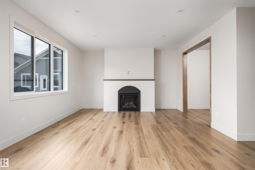 8 Darby Crescent, Spruce Grove, AB - Indoor Photo Showing Living Room With Fireplace
