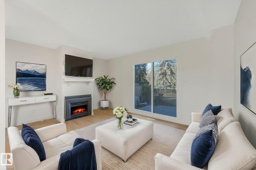 Virtually staged - 5833 Riverbend Road Nw, Edmonton, AB - Indoor Photo Showing Living Room With Fireplace