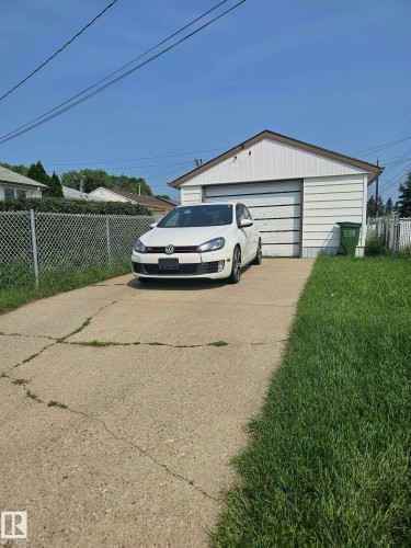 Detached garage with horizontal siding and a gambrel roofline - 13103 63 Street Nw, Edmonton, AB - Outdoor