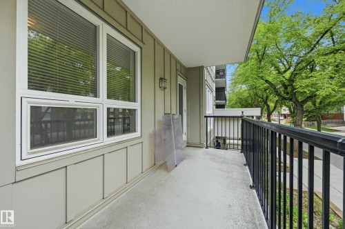 Spacious private balcony with concrete flooring and black metal railings - #203 11103 84 Av Nw, Edmonton, AB - Outdoor With Balcony With Exterior