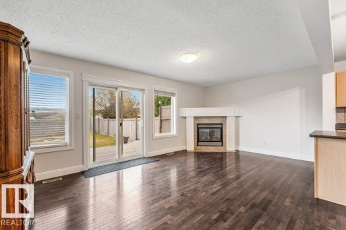 3545 11 Street Nw, Edmonton, AB - Indoor Photo Showing Other Room With Fireplace
