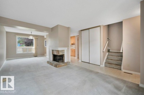 #22 1651 46 St Nw, Edmonton, AB - Indoor Photo Showing Other Room With Fireplace