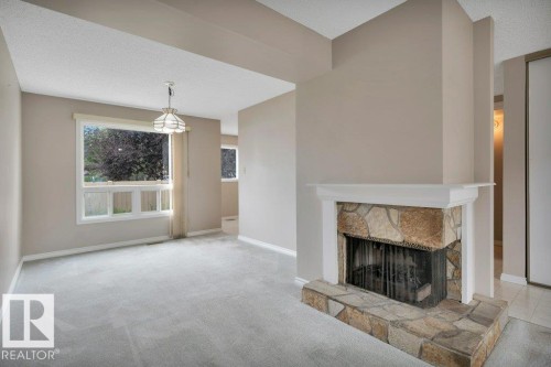 #22 1651 46 St Nw, Edmonton, AB - Indoor Photo Showing Living Room With Fireplace
