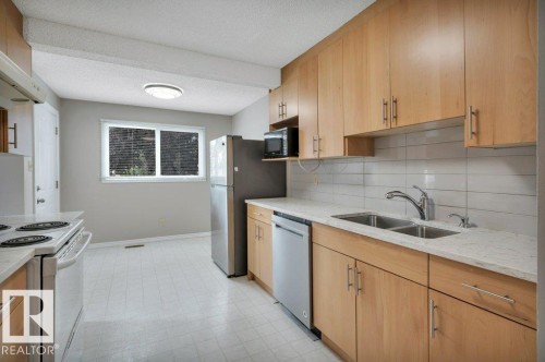 #22 1651 46 St Nw, Edmonton, AB - Indoor Photo Showing Kitchen With Double Sink